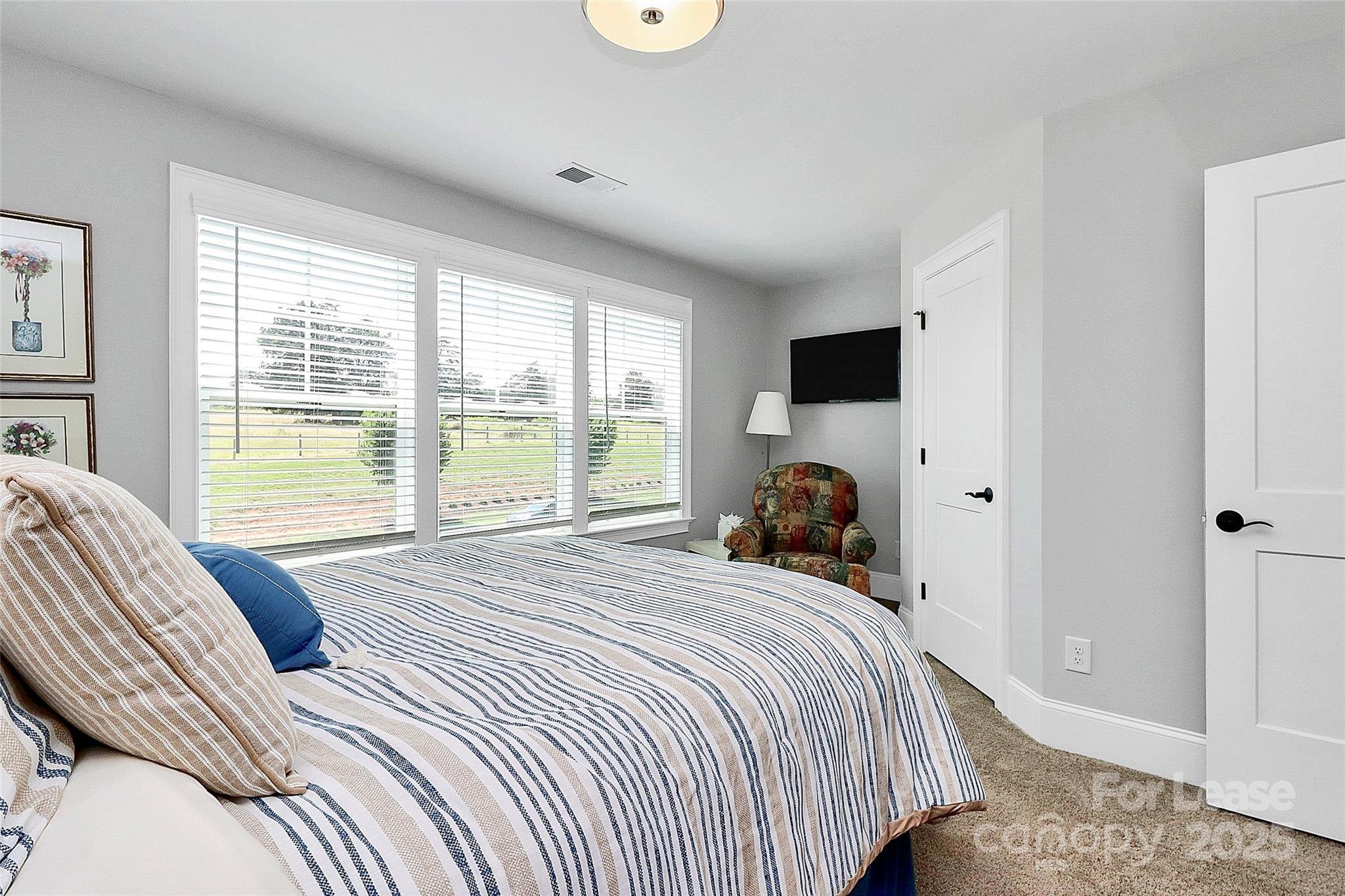 136 Preston Road Mooresville, NC 28117 - Photo 15 of 46 a bedroom with a bed and a large window