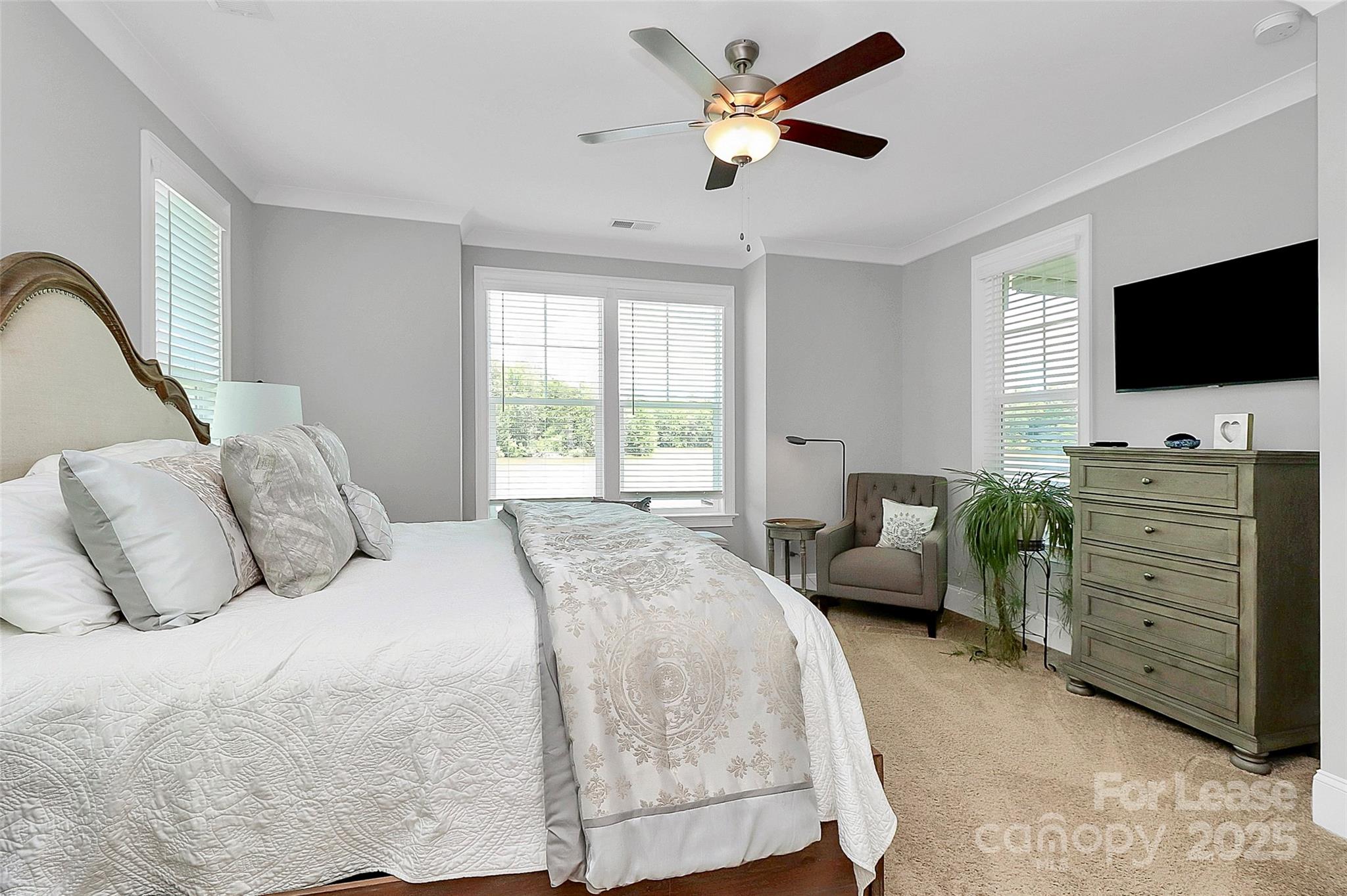 136 Preston Road Mooresville, NC 28117 - Photo 17 of 46 a bedroom with a bed and a flat screen tv