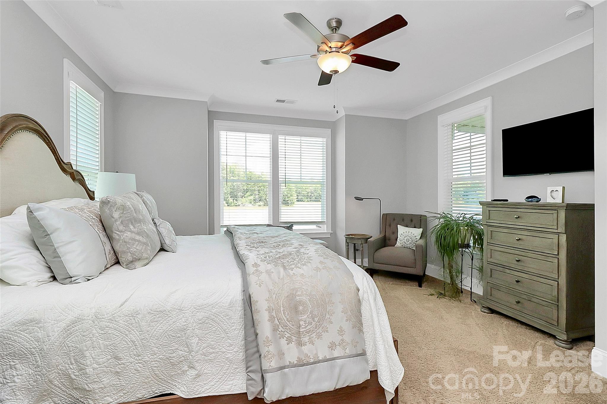 136 Preston Road Mooresville, NC 28117 - Photo 18 of 46 a bedroom with a bed and a flat screen tv