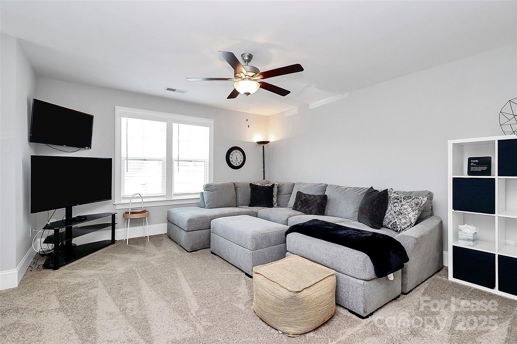 136 Preston Road Mooresville, NC 28117 - Photo 20 of 46 a living room with furniture and a flat screen tv