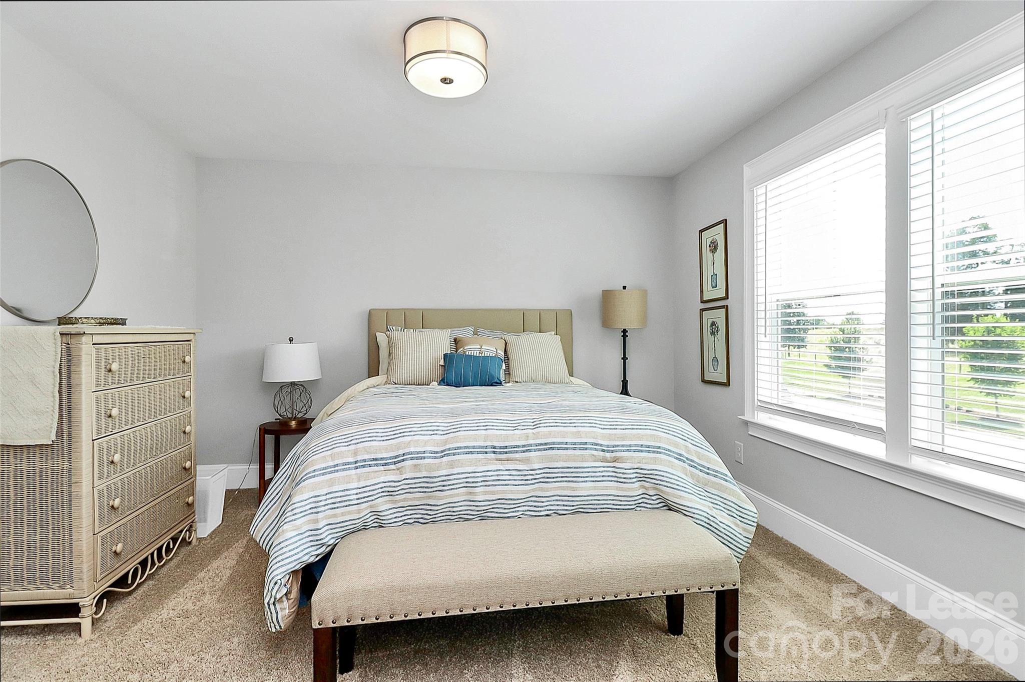 136 Preston Road Mooresville, NC 28117 - Photo 20 of 46 a bedroom with a bed and window