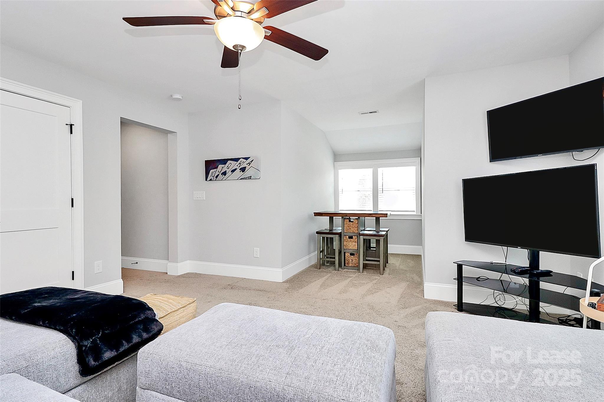 136 Preston Road Mooresville, NC 28117 - Photo 21 of 46 a bedroom with a bed and a flat screen tv