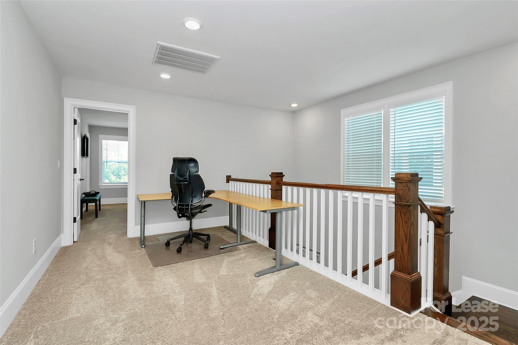 136 Preston Road Mooresville, NC 28117 - Photo 22 of 46 a view of a workspace with furniture and a window
