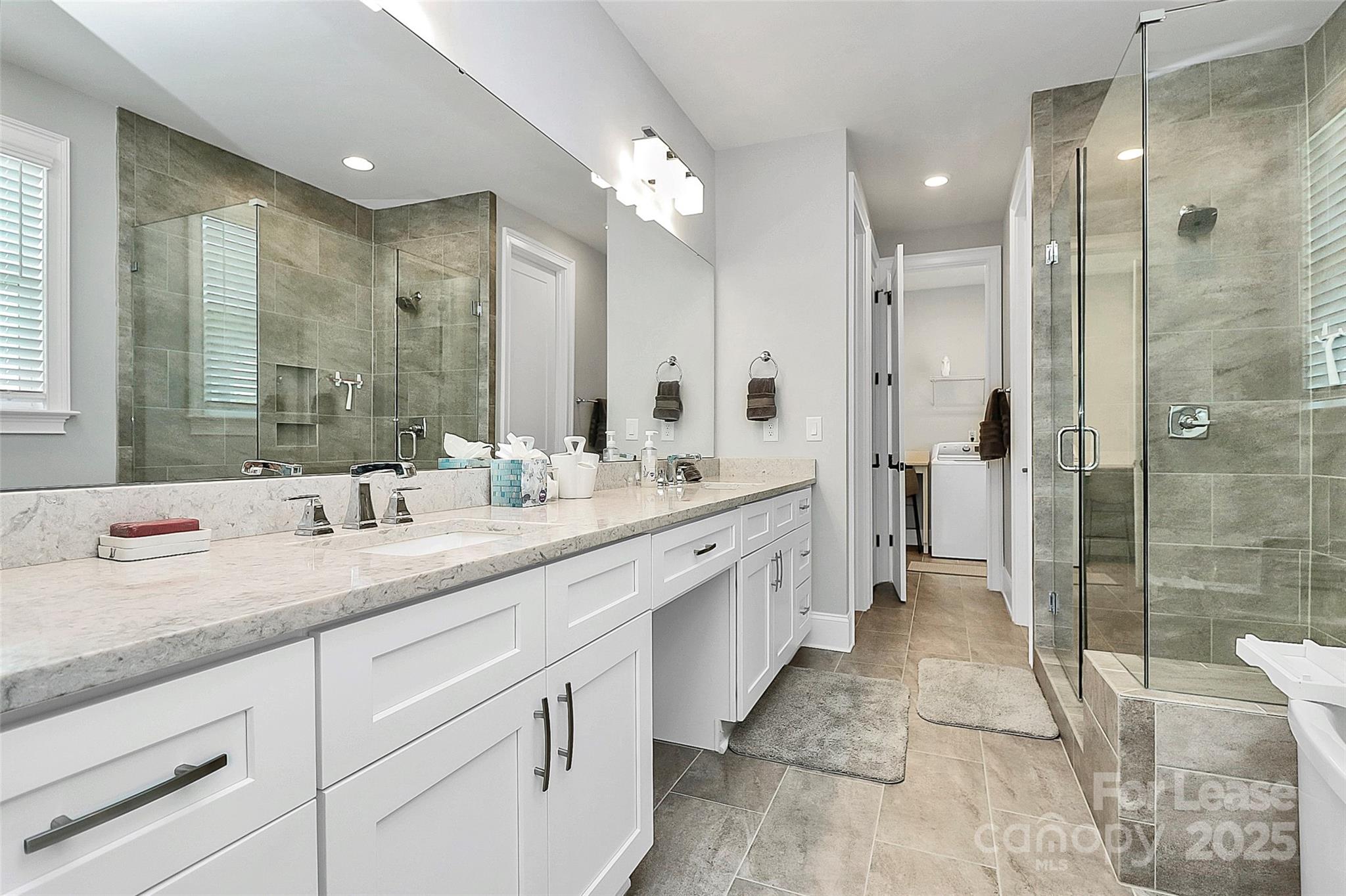 136 Preston Road Mooresville, NC 28117 - Photo 25 of 46 a spacious bathroom with a shower sink and mirror