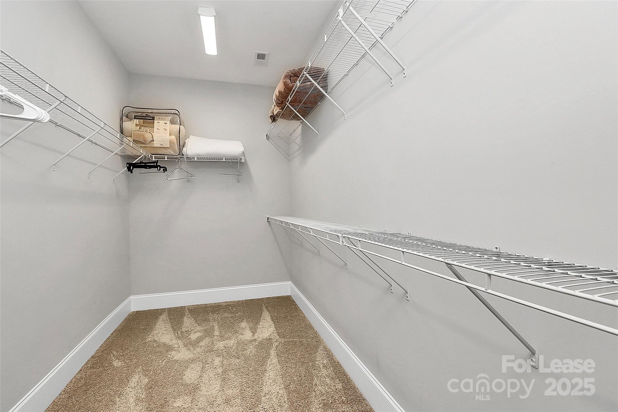 136 Preston Road Mooresville, NC 28117 - Photo 28 of 46 a view of walk in closet with clothes