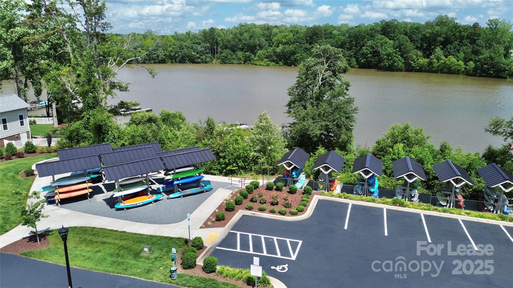 136 Preston Road Mooresville, NC 28117 - Photo 37 of 46 an aerial view of a house with a garden and lake view