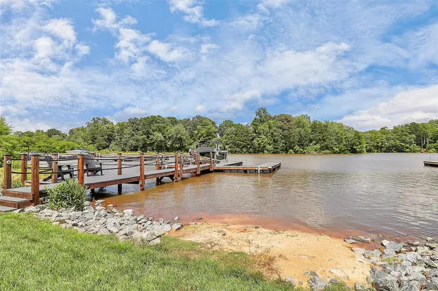 a view of a lake with houses in the back
