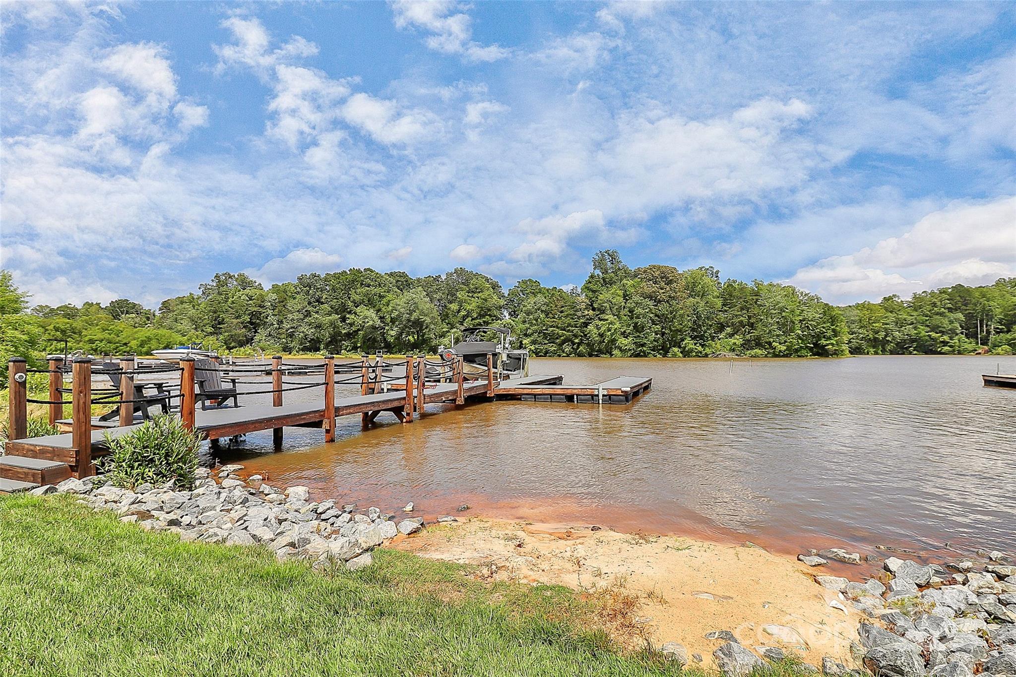 136 Preston Road Mooresville, NC 28117 - Photo 40 of 46 a view of a lake with houses in the back