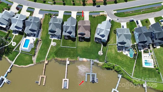 an aerial view of houses with yard