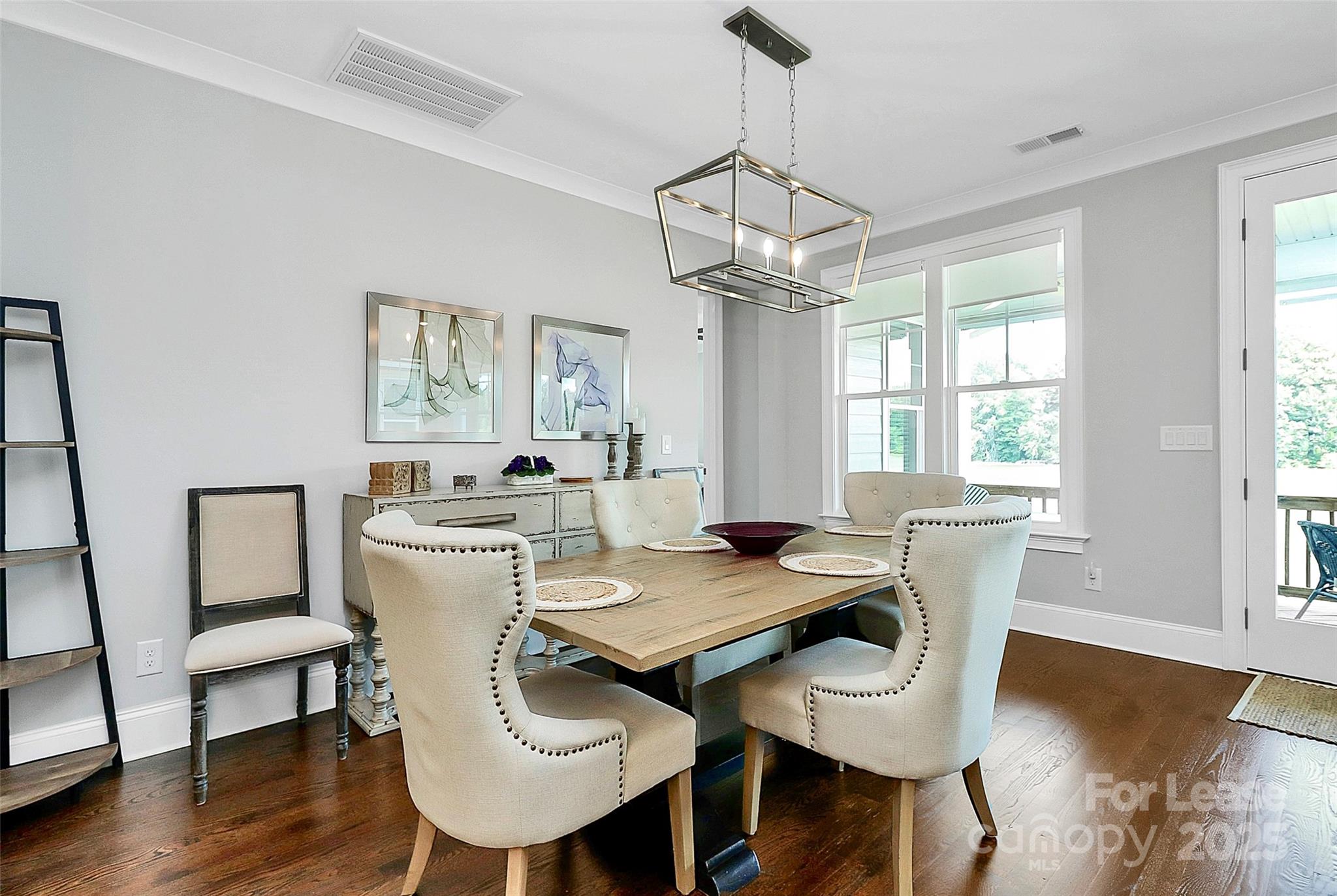 136 Preston Road Mooresville, NC 28117 - Photo 6 of 46 a view of a dining room with furniture window and wooden floor