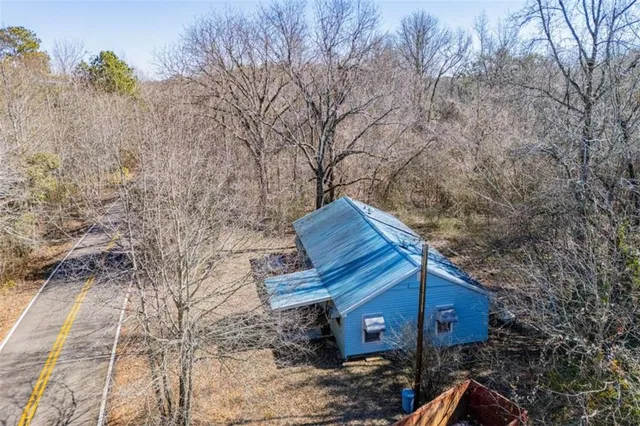 a view of a house with a tree