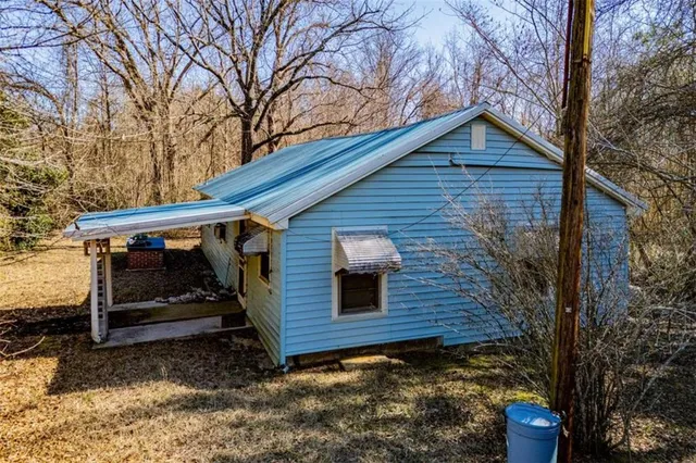a front view of a house with parking area