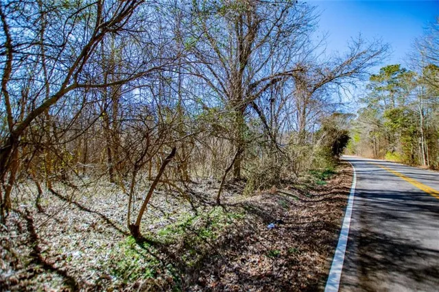 a view of a backyard with swimming pool
