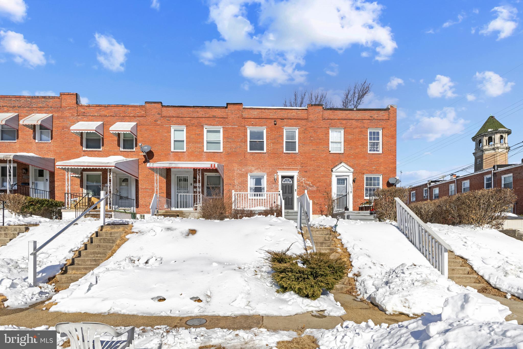1002 West 43rd Street Baltimore, MD 21211 - Photo 1 of 23 a view of a house with a yard