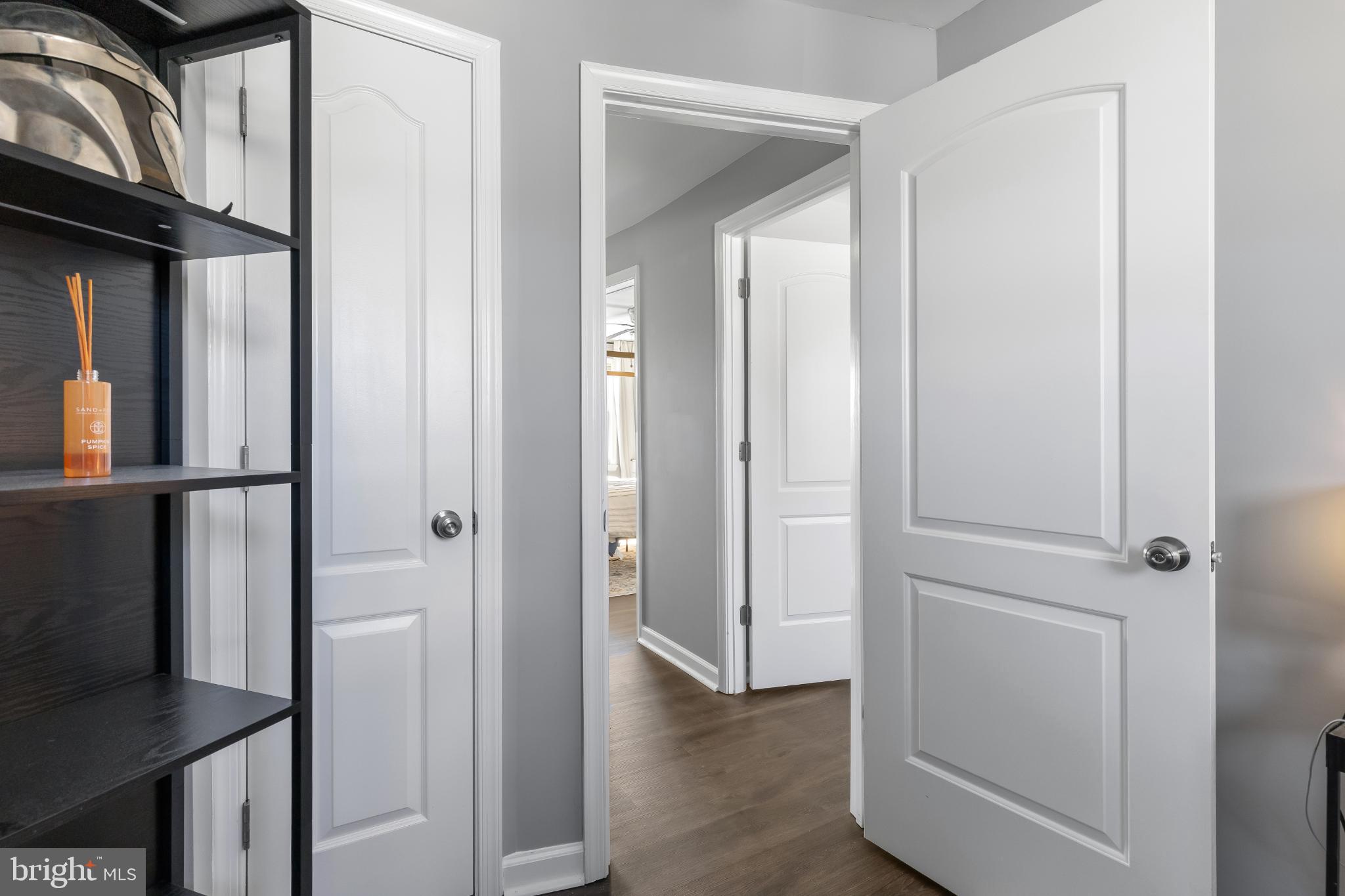 1002 West 43rd Street Baltimore, MD 21211 - Photo 15 of 23 a view of a hallway with wooden floor and staircase