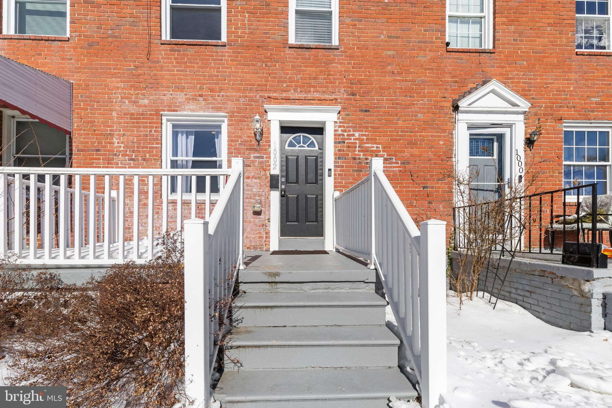 1002 West 43rd Street Baltimore, MD 21211 - Photo 2 of 23 a view of a brick house front of house