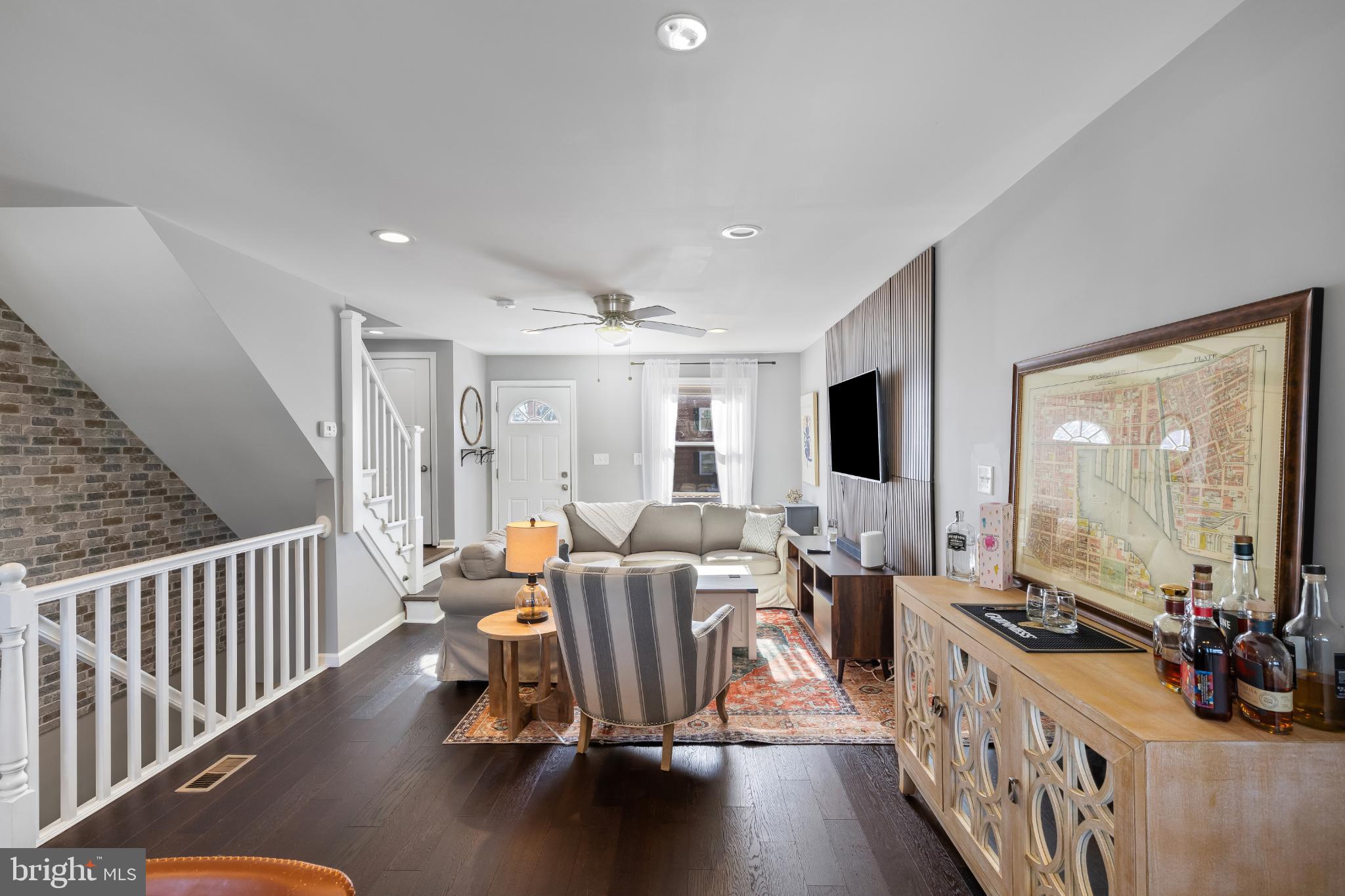 1002 West 43rd Street Baltimore, MD 21211 - Photo 8 of 23 a living room with furniture and a flat screen tv