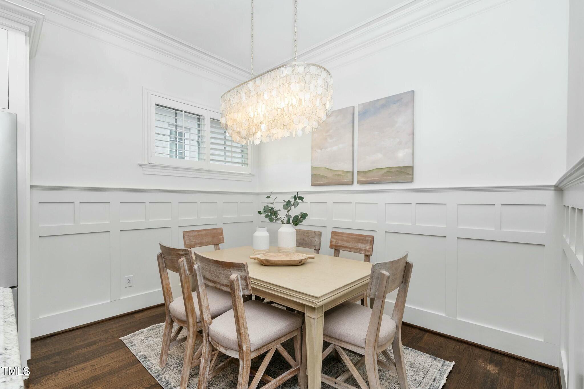 543 Guilford Circle Raleigh, NC 27608 - Photo 13 of 62 a view of a dining room with furniture and wooden floor