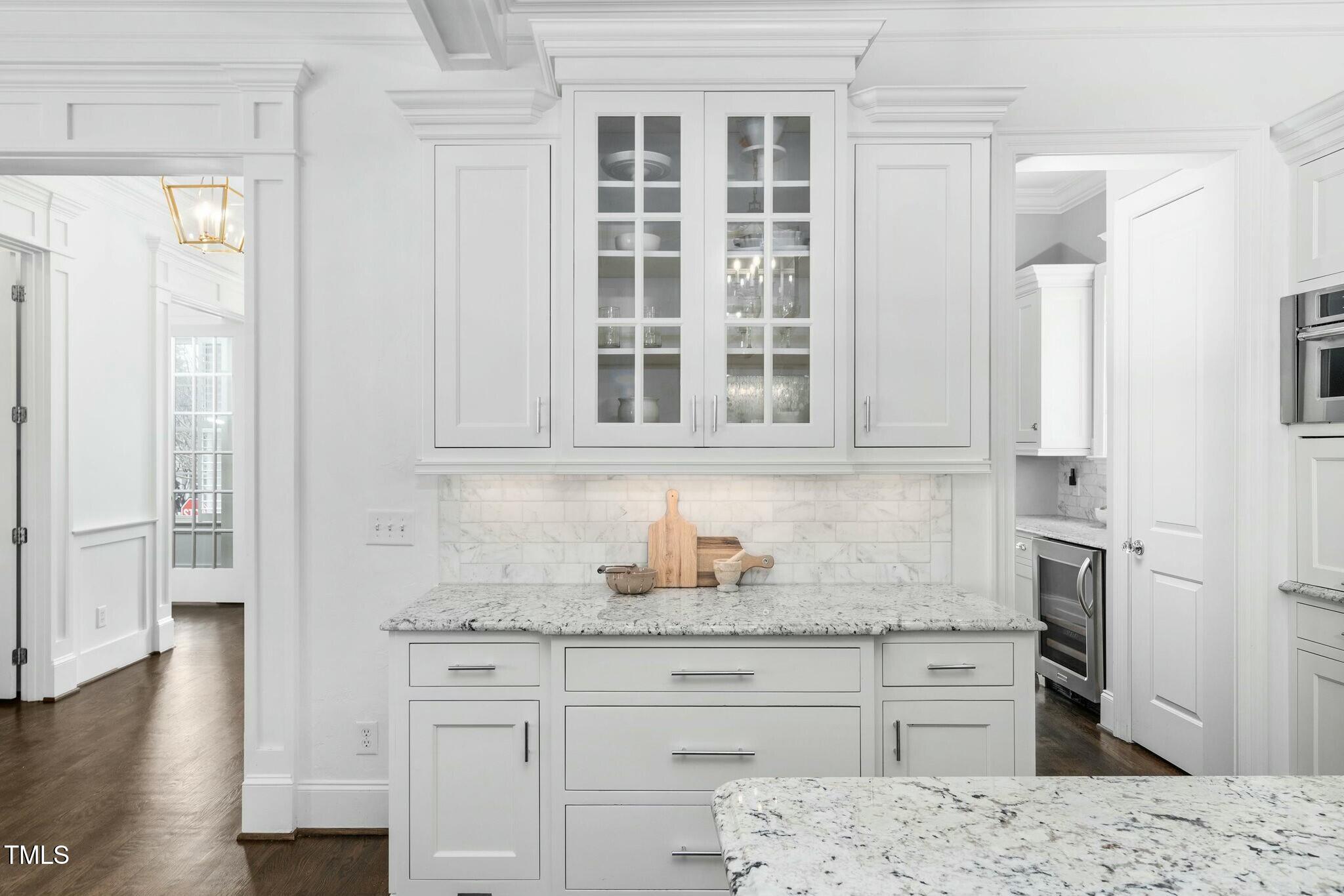 543 Guilford Circle Raleigh, NC 27608 - Photo 14 of 62 a kitchen with granite countertop a sink cabinets stainless steel appliances and a window