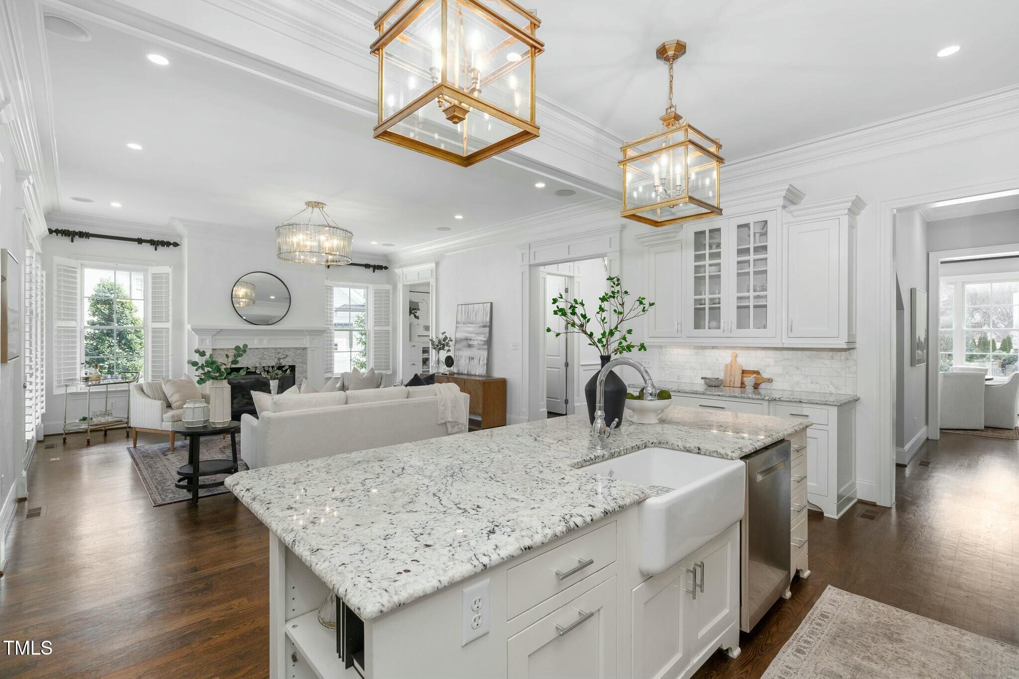 543 Guilford Circle Raleigh, NC 27608 - Photo 15 of 62 a large kitchen with a table and chairs in it