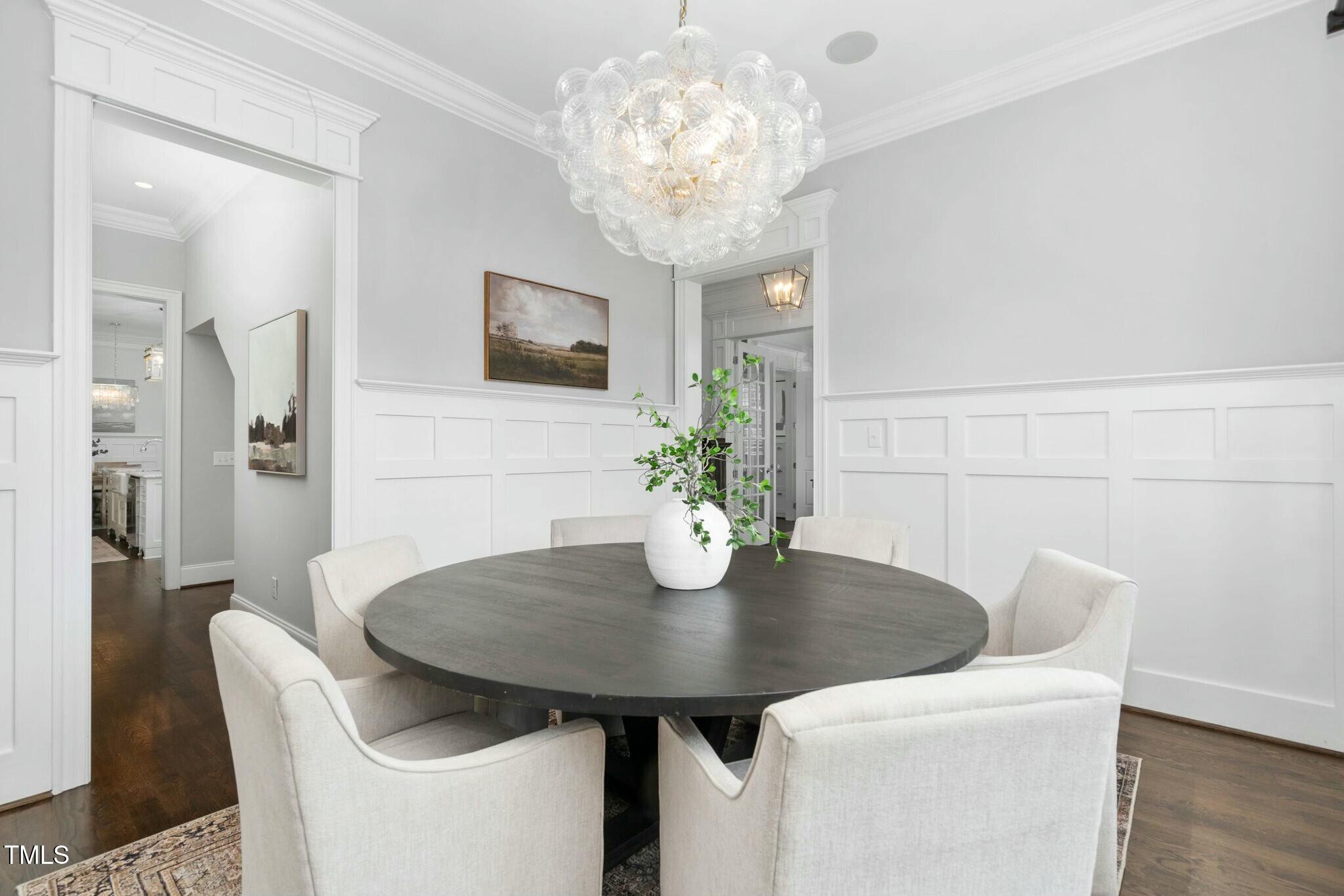 543 Guilford Circle Raleigh, NC 27608 - Photo 21 of 62 a view of a dining room with furniture and wooden floor