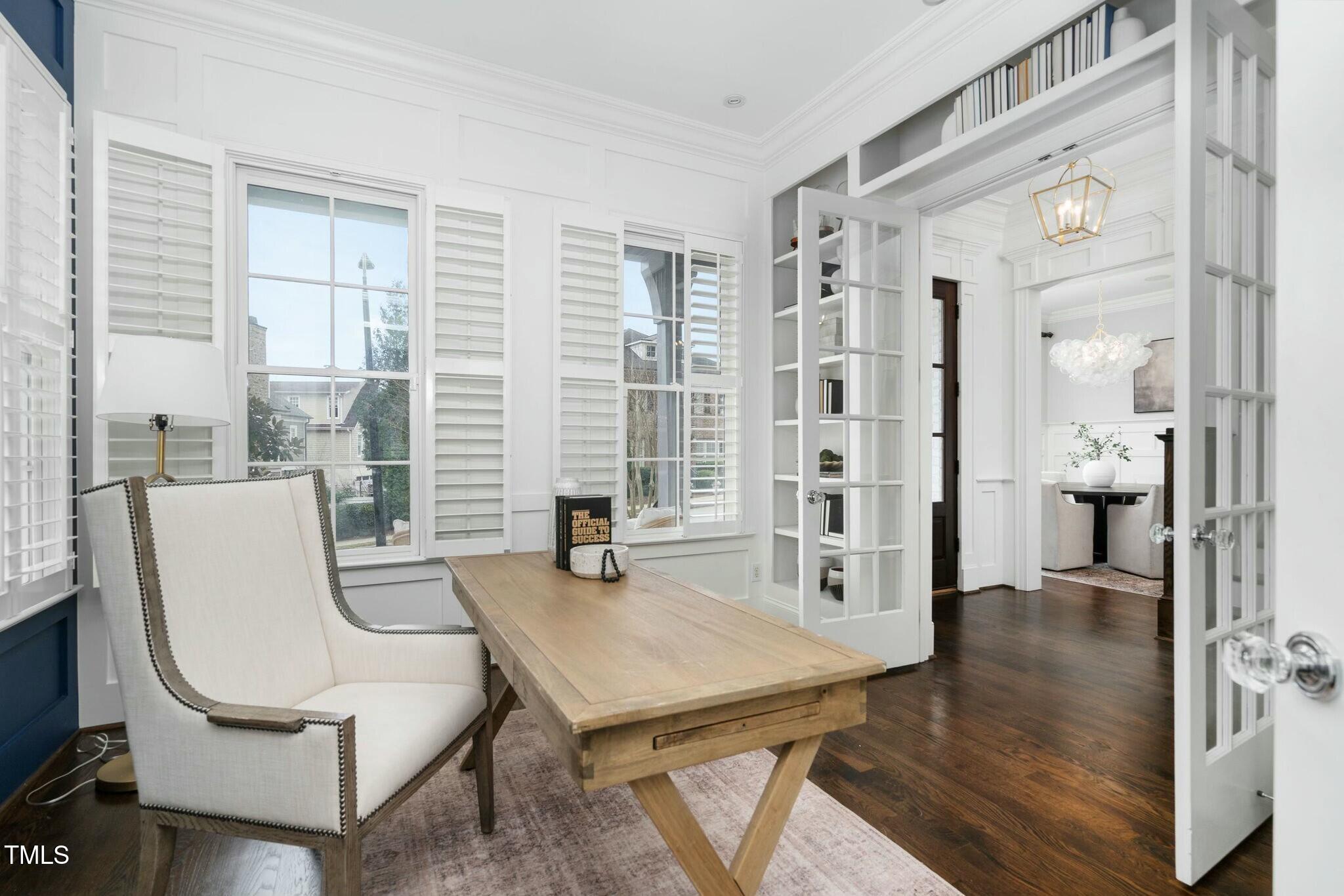 543 Guilford Circle Raleigh, NC 27608 - Photo 26 of 62 a living room with furniture a large window and a table