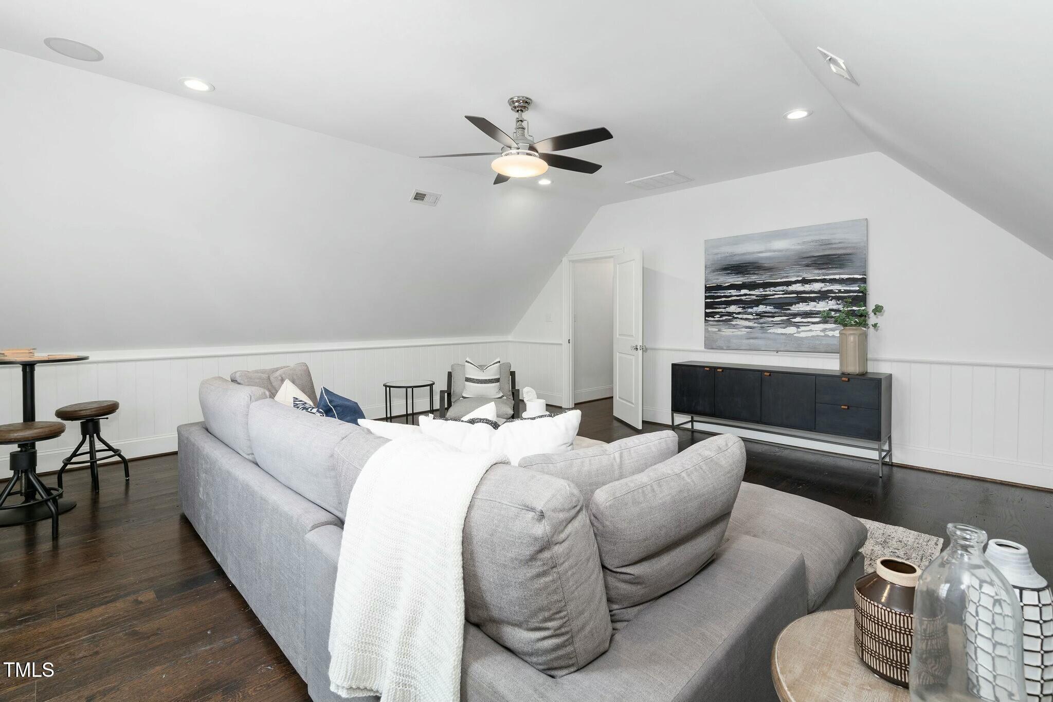 543 Guilford Circle Raleigh, NC 27608 - Photo 35 of 62 a living room with furniture and a ceiling fan