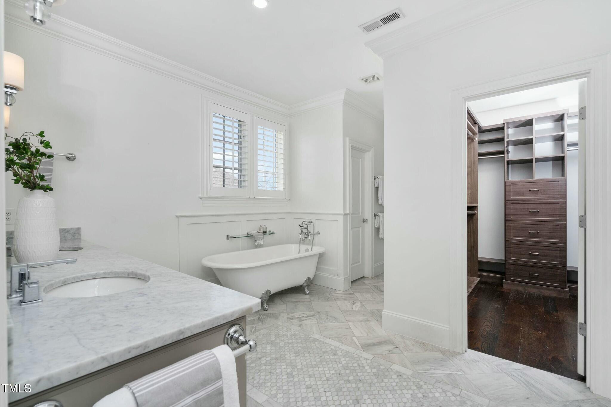 543 Guilford Circle Raleigh, NC 27608 - Photo 40 of 62 a bathroom with a granite countertop sink a toilet and shower