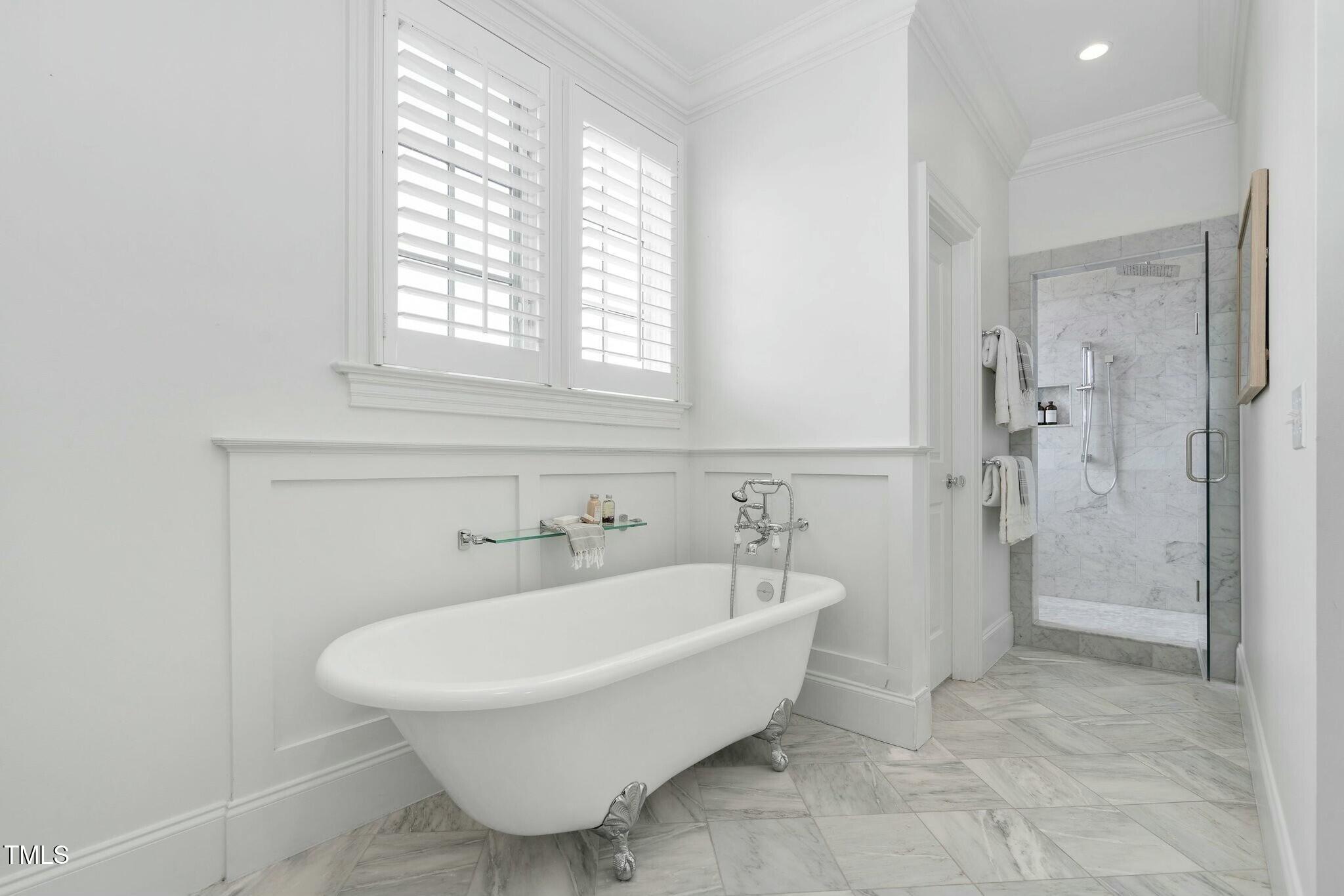 543 Guilford Circle Raleigh, NC 27608 - Photo 42 of 62 a spacious bathroom with a bathtub and shower