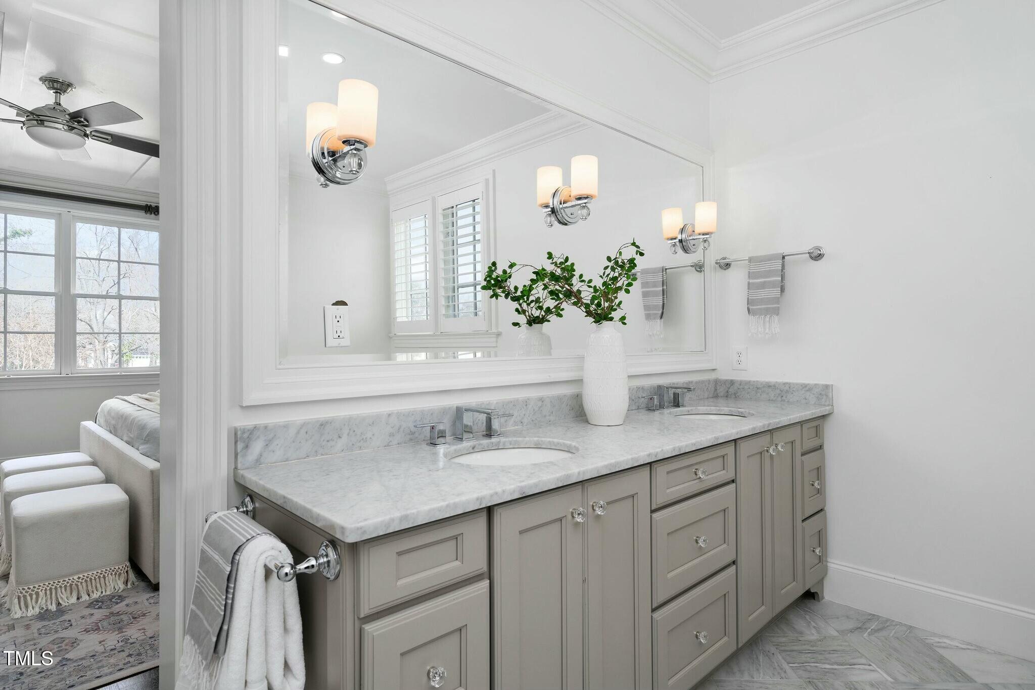 543 Guilford Circle Raleigh, NC 27608 - Photo 43 of 62 a bathroom with a granite countertop sink and a mirror