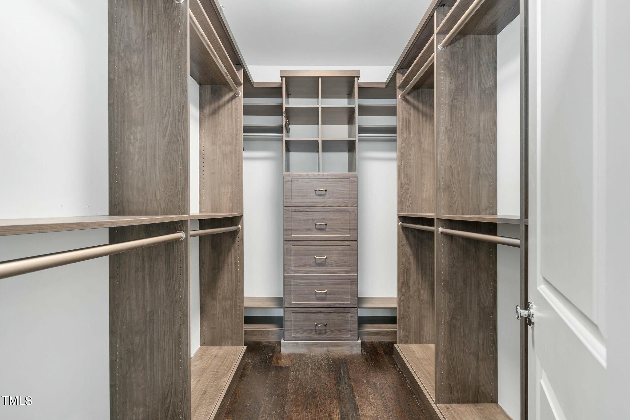 543 Guilford Circle Raleigh, NC 27608 - Photo 44 of 62 a view of walk in closet with empty racks