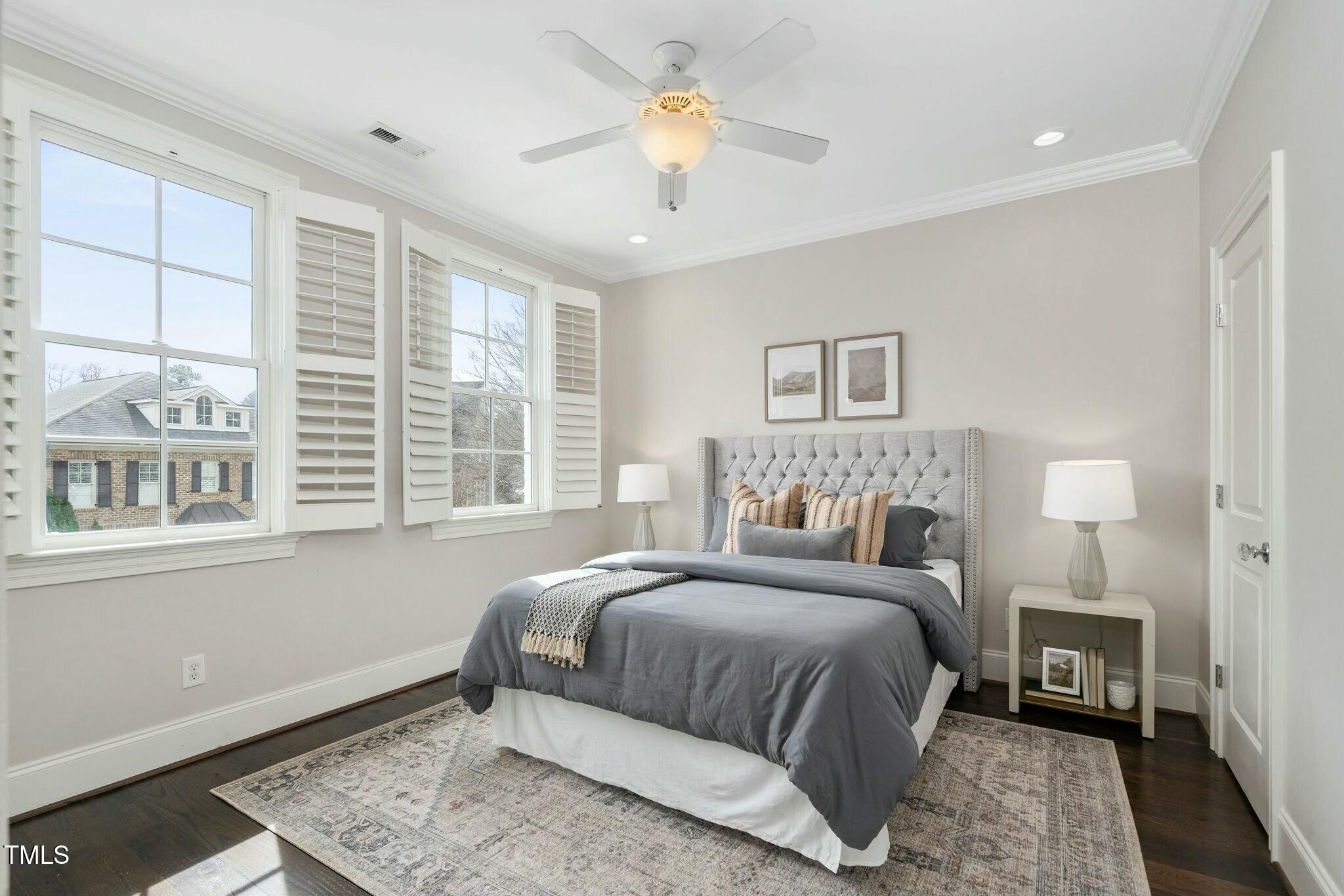 543 Guilford Circle Raleigh, NC 27608 - Photo 46 of 62 a bedroom with a bed and a window