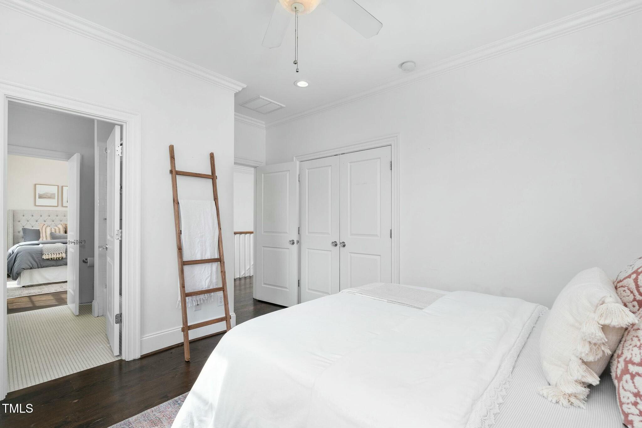 543 Guilford Circle Raleigh, NC 27608 - Photo 50 of 62 a bedroom with a bed and a view of bathroom