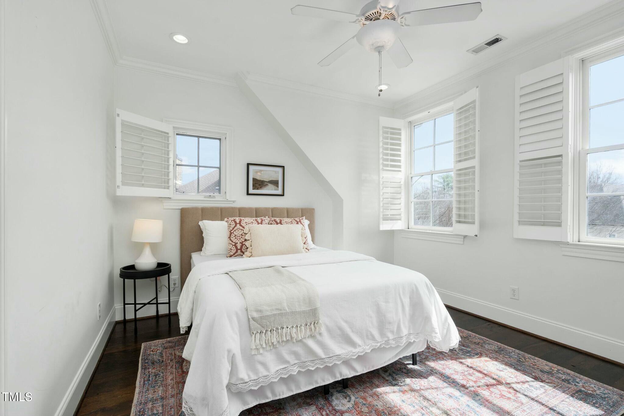 543 Guilford Circle Raleigh, NC 27608 - Photo 51 of 62 a bedroom with a bed and window