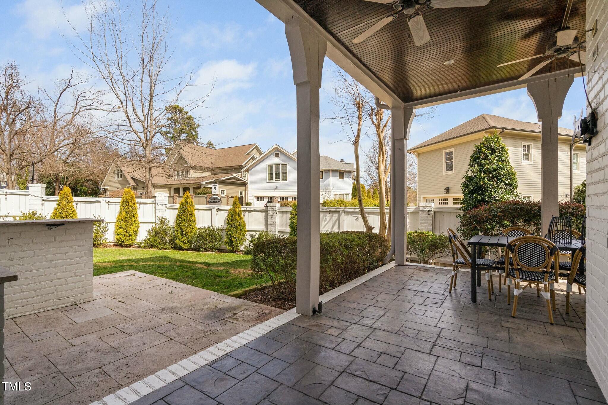 543 Guilford Circle Raleigh, NC 27608 - Photo 53 of 62 a view of a patio with table and chairs and potted plants