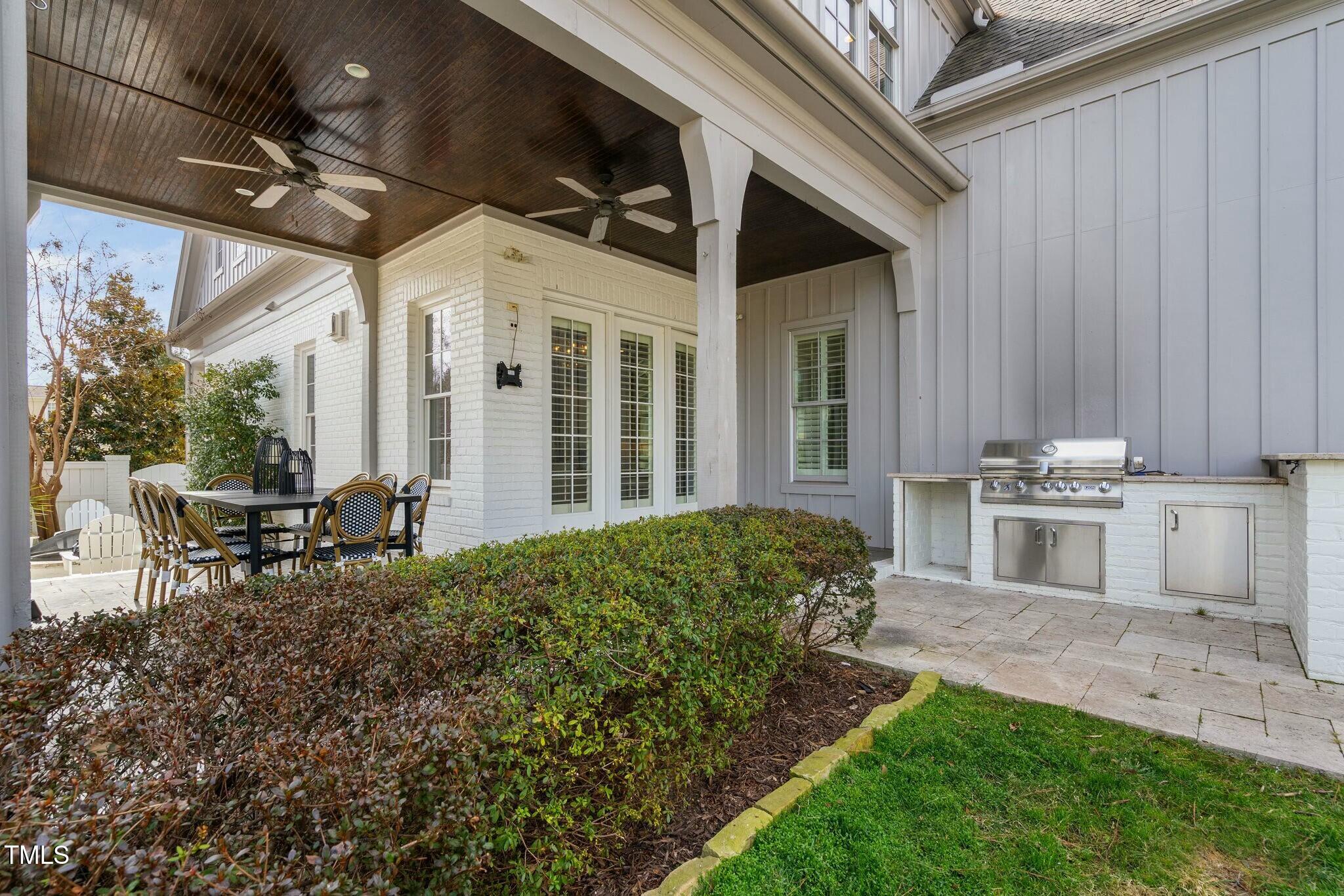 543 Guilford Circle Raleigh, NC 27608 - Photo 55 of 62 a view of a porch with chairs and backyard