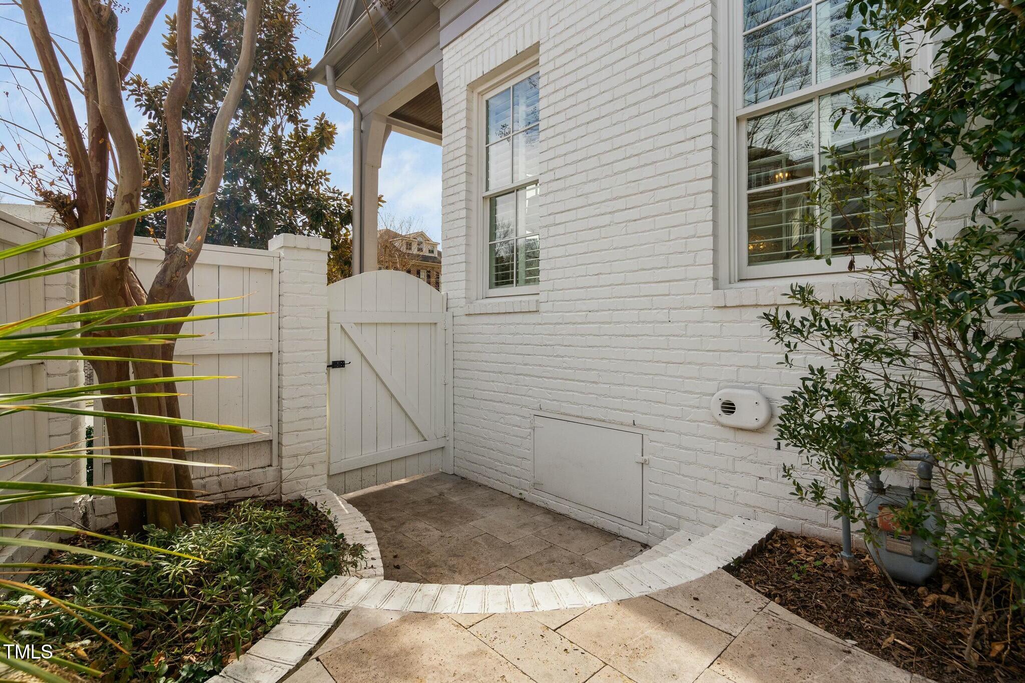 543 Guilford Circle Raleigh, NC 27608 - Photo 59 of 62 a view of a pathway of a house