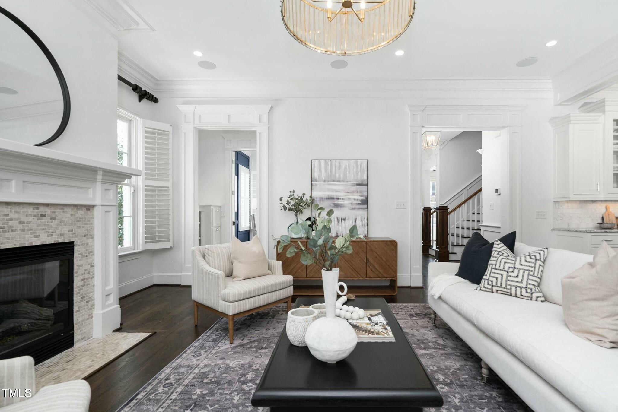 543 Guilford Circle Raleigh, NC 27608 - Photo 6 of 62 a living room with furniture and a fireplace