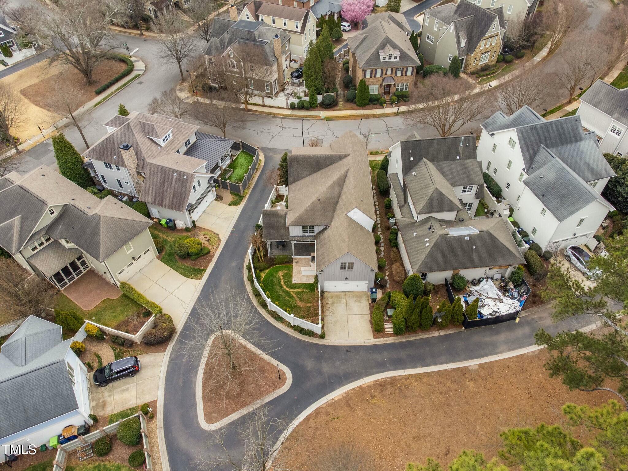 543 Guilford Circle Raleigh, NC 27608 - Photo 62 of 62 an aerial view of a house with a swimming pool