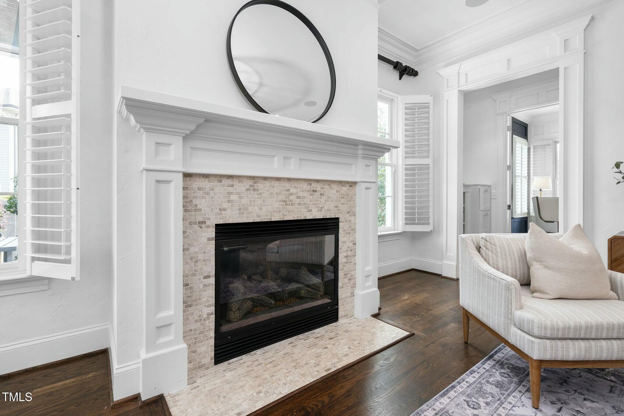 543 Guilford Circle Raleigh, NC 27608 - Photo 9 of 62 a living room with furniture a large window and a fireplace