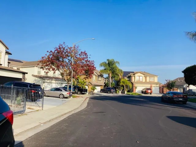 a view of street with parked cars