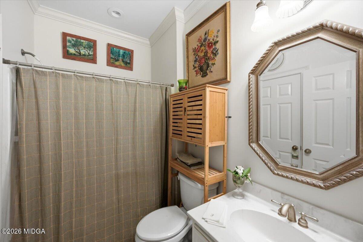 210 Oberon Place Macon, GA 31210 - Photo 22 of 31 a bathroom with a sink a toilet and shower
