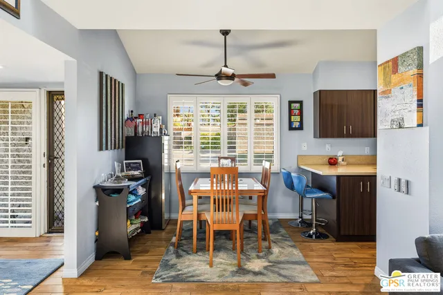 a view of a dining room with furniture window and outside view