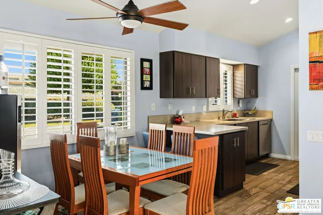 a view of a dining room with furniture window and wooden floor