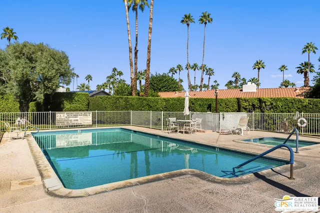 a view of a park with chairs