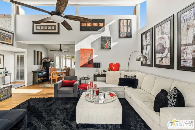 a living room with furniture and a rug