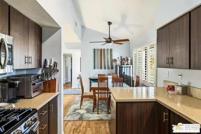 a kitchen with sink cabinets and stove