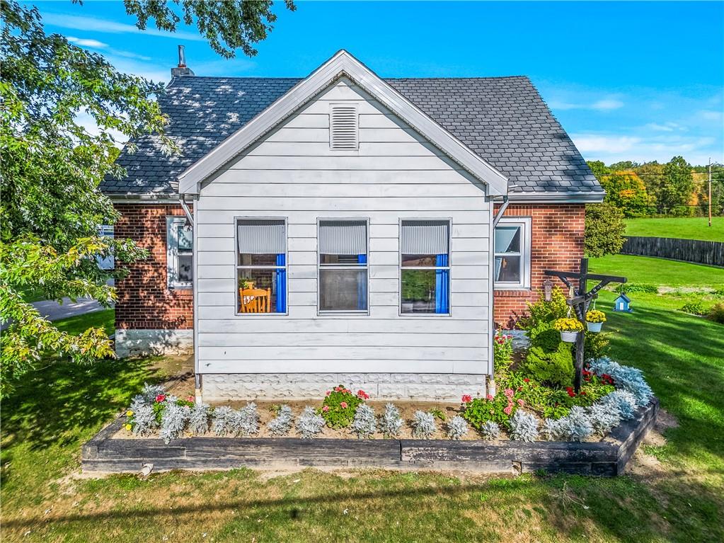 332 Pulaski Road Pulaski, PA 16143 - Photo 1 of 33 a view of a house with a yard and plants