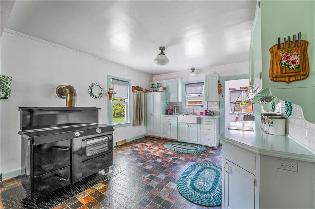 332 Pulaski Road Pulaski, PA 16143 - Photo 16 of 33 a room with furniture and a fireplace