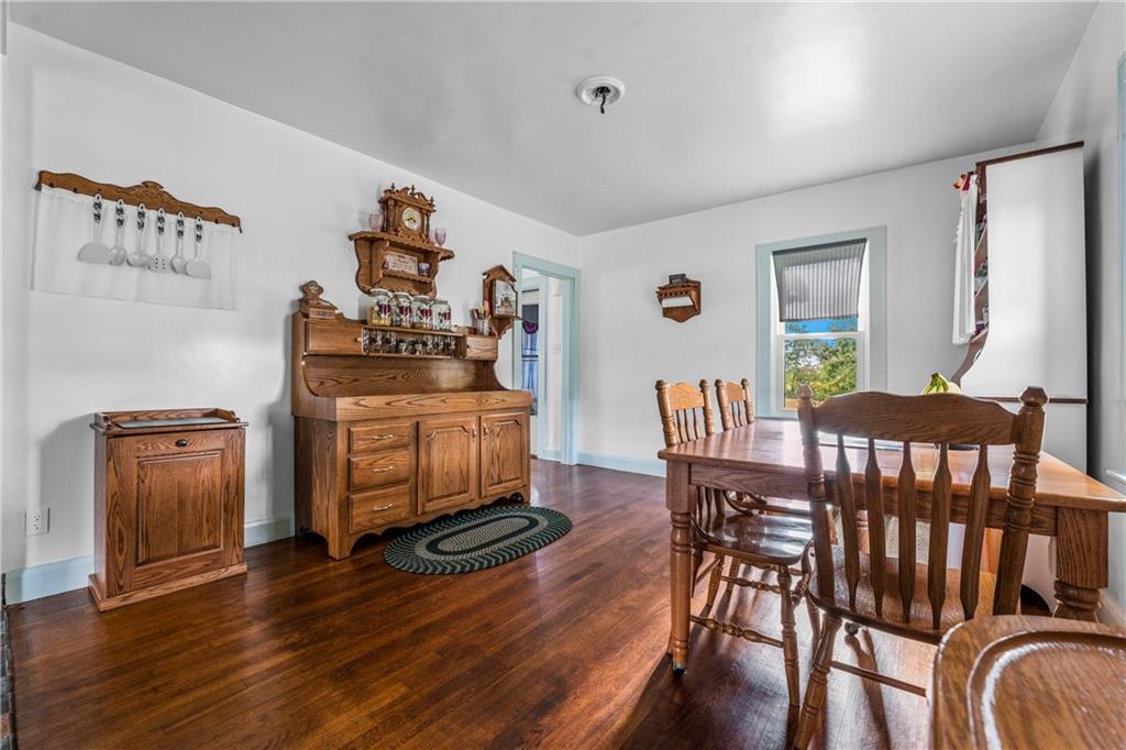 332 Pulaski Road Pulaski, PA 16143 - Photo 17 of 33 a view of a dining room with furniture and wooden floor